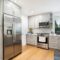 Contemporary kitchen interior featuring stainless steel appliances and sleek cabinetry.