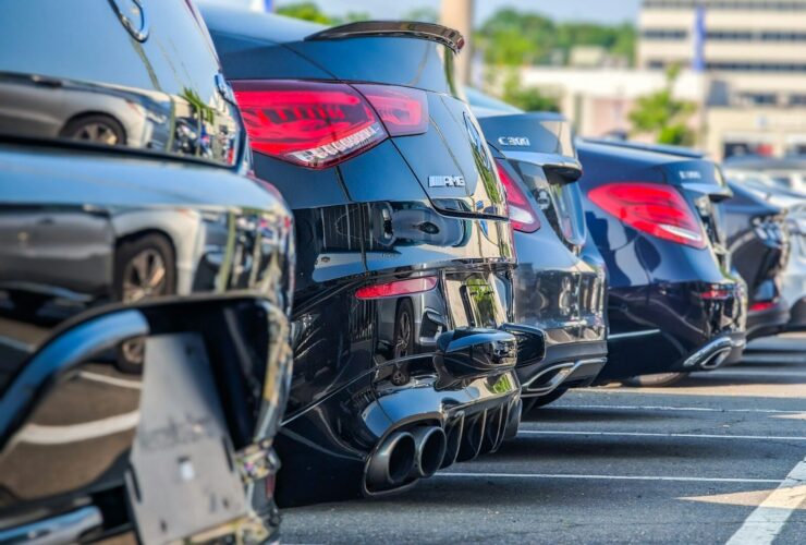 a row of parked cars in a parking lot
