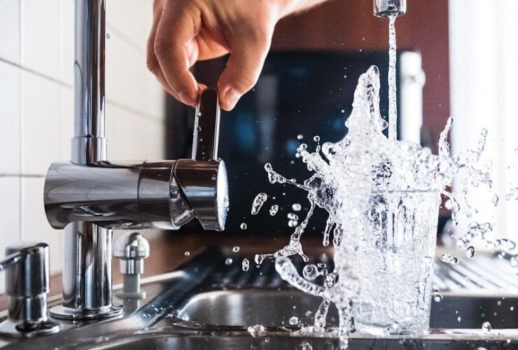 person opening faucet