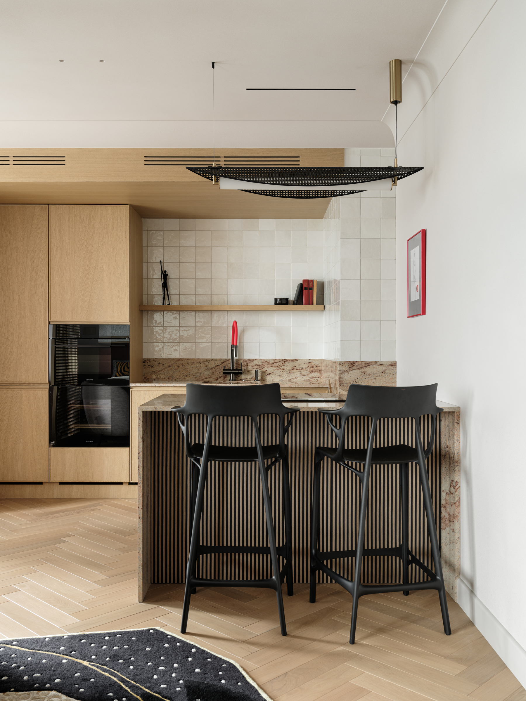 open plan living room and kitchen with oak herringbone flooring