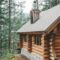 brown wooden house surrounded by green trees during daytime