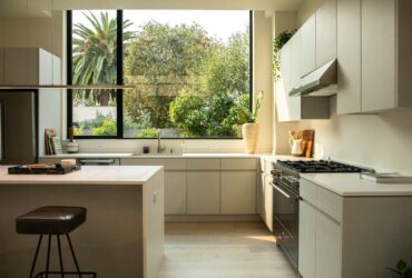 modern kitchen with island and large window