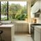 modern kitchen with island and large window