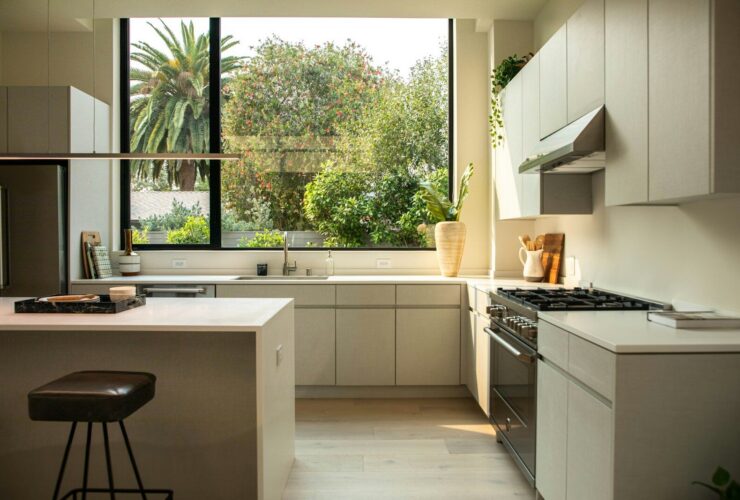 modern kitchen with island and large window