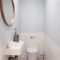 white ceramic sink with stainless steel faucet