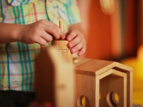 person playing wooden stackables