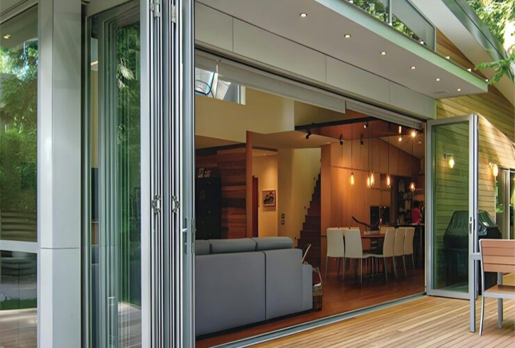 Modern home with folding glass doors opening to deck